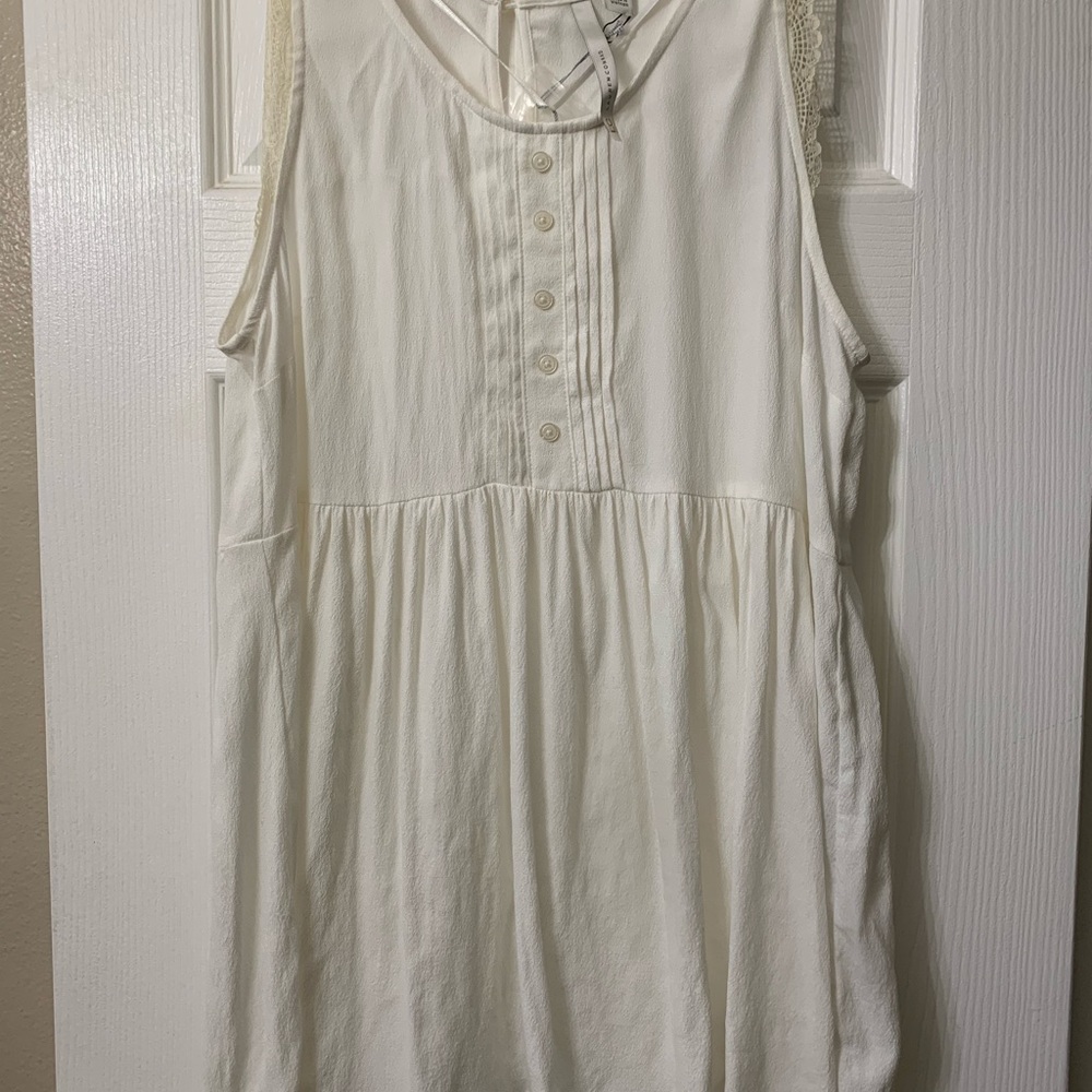 Lauren Conrad babydoll tank top with ruffle sleeves and button detail
